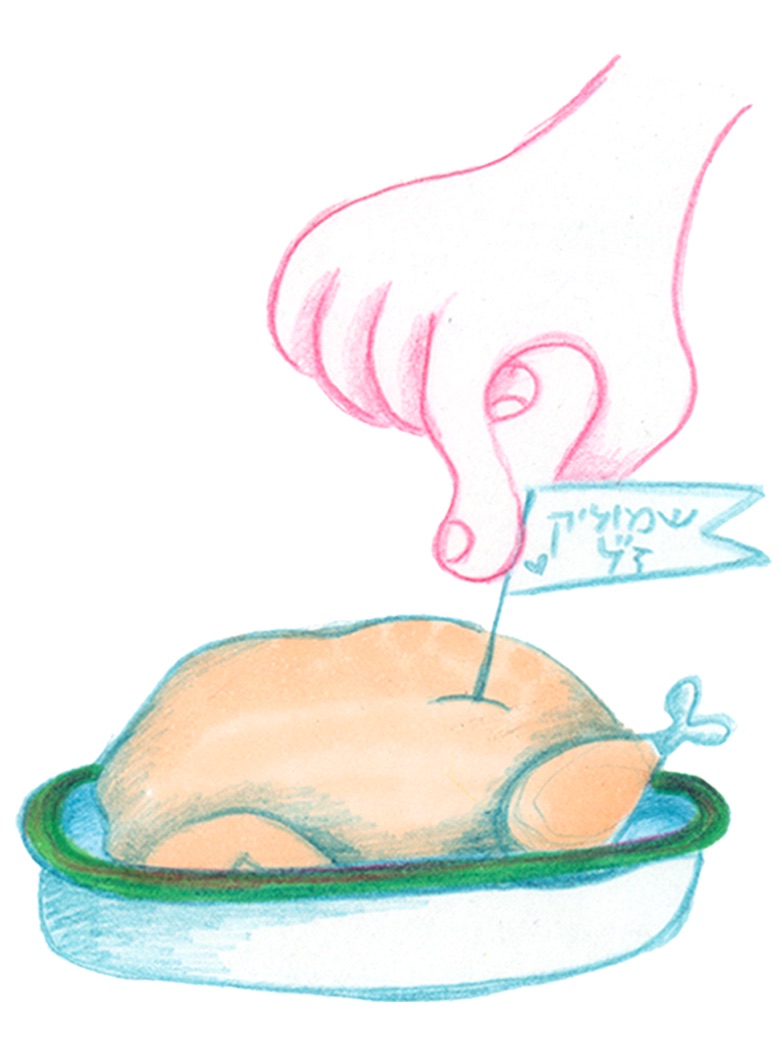 A hand placing a name tag on a roasted chicken