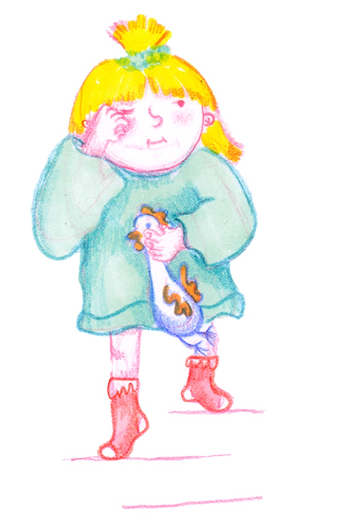 A girl holding a small chicken