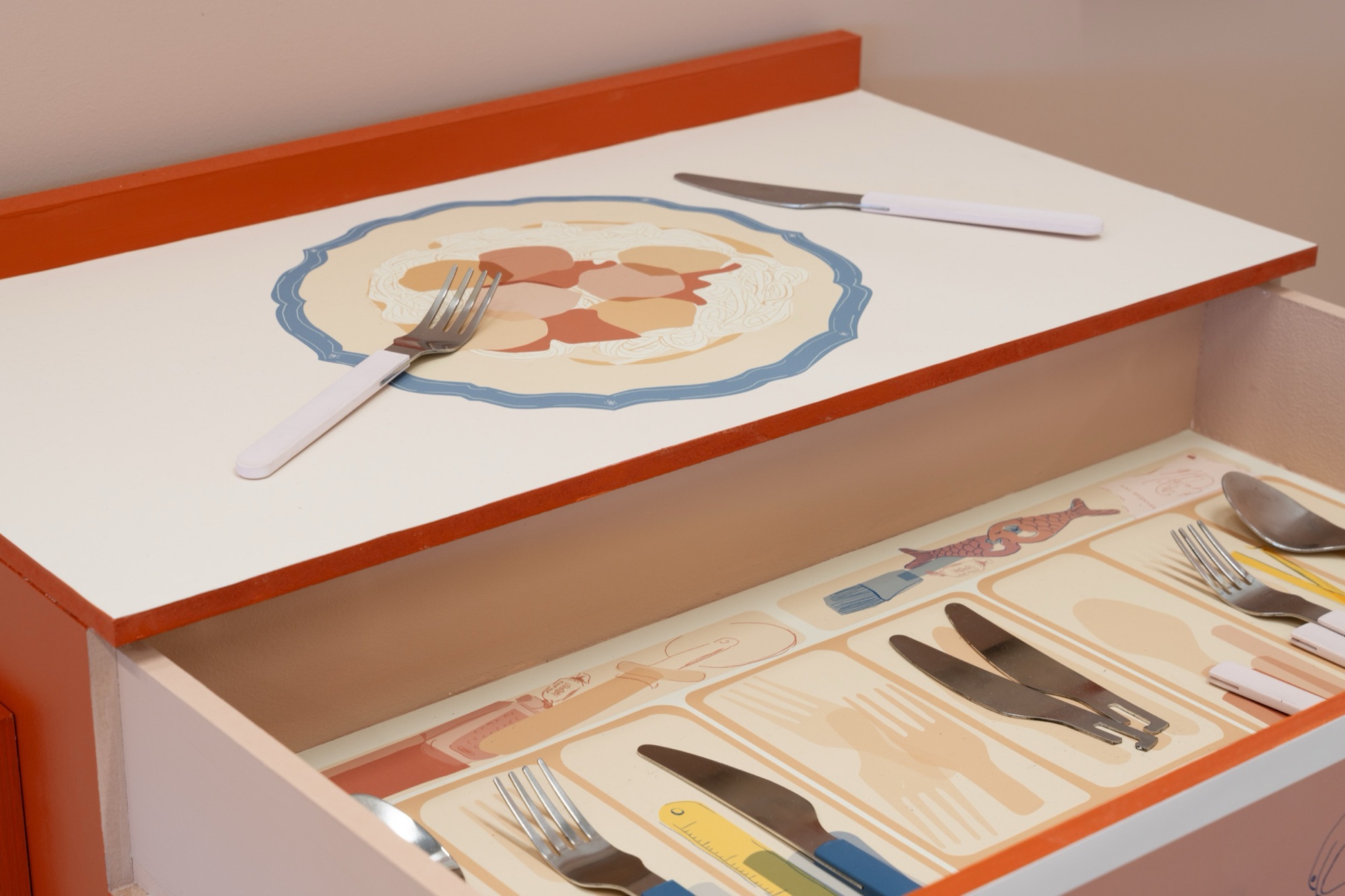 An illustrated drawer with cutlery